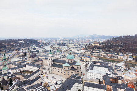 The view across Salzburg Old Town in Austria.  In the foreground is Salzburg Cathedral, a Roman Catholic cathedral built in a Baroque style.のeditorial素材