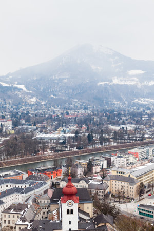 The view across Salzburg Old Town and the Salzach River in Austria.  In the background can be seen Gaisberg a mountain to the East of the city.のeditorial素材
