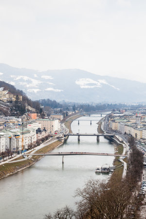 A winter view along the Salzach River in Salzburg, Austria.のeditorial素材