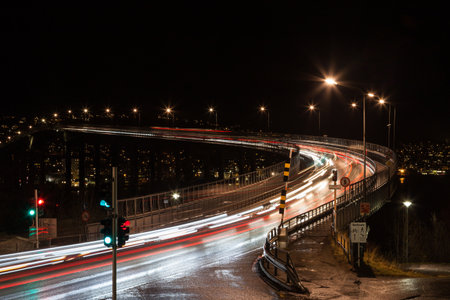 Night time light trails are pictured as traffic passes over Tromso bridge in northern Norway.