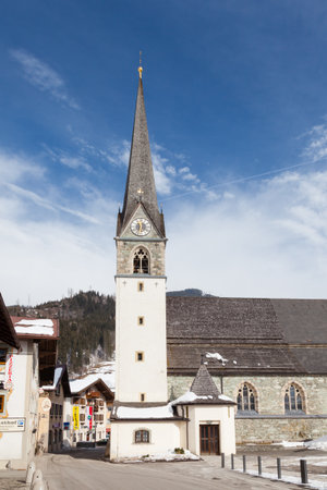 A winter view of the Catholic parish church of Bruck an der Grossglocknerstrasse in the state of Salzburg, Austriaのeditorial素材