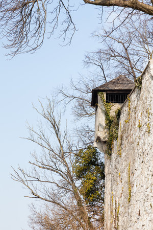 A fortified tower adorns the fortified walls on Kapzinerberg.  Kapuzinerberg is a hill in Salzburg, Austria.の写真素材