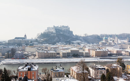 A winter view across the Salzach river from Kapuzinerberg mountain in Austria.  Salzburg "Old" town and Hohensalzburg Fortress can be seen.のeditorial素材