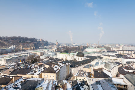 The "New" Salzburg skyline on a winter day viewed from Kapuzinerberg mountain in Austria.のeditorial素材
