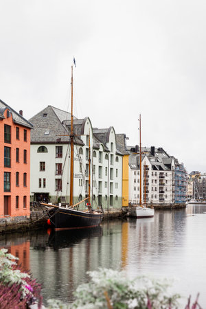 Historic buildings line the Alesund waterfront in Norway.  Alesund is a port town on the west coast of Norway.のeditorial素材