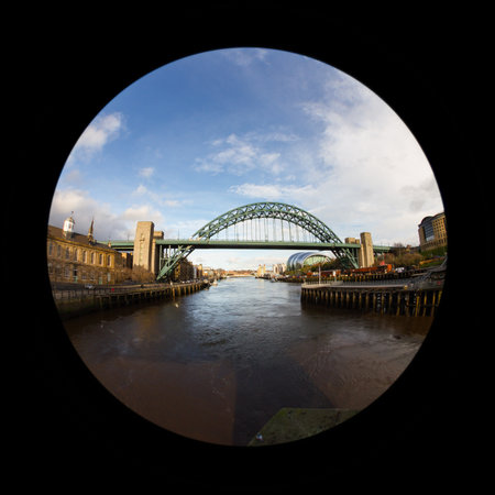 A fish eye view of the Tyne Bridge in Newcastle upon Tyne, England.  The Sage, a centre for musical...