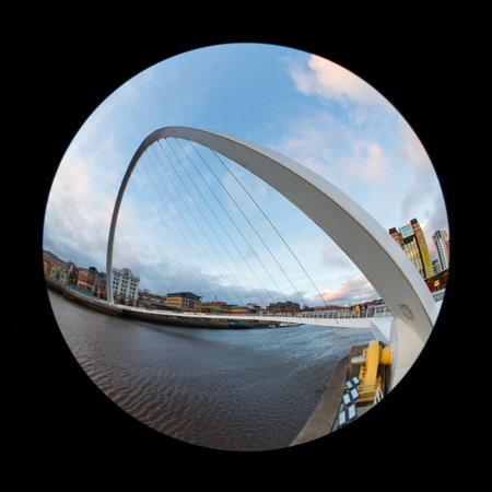 A fish eye view of the Gateshead Millennium Bridge in North East England.  The bridge connects...