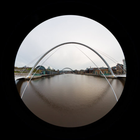 A fish eye view looking through Gateshead Millennium Bridge up the River Tyne.  The bridge connects Newcastle upon Tyne and Gateshead in northern England.のeditorial素材