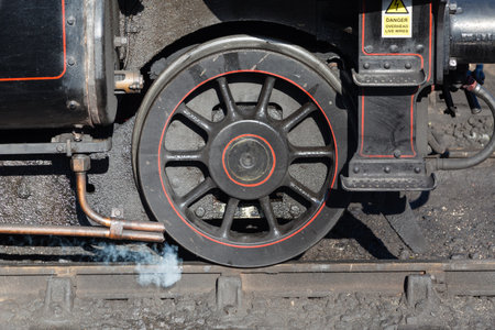 A close up of the leading wheel on a steam train.のeditorial素材