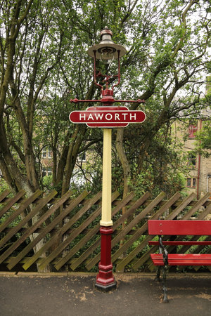 A destination sign mounted on a traditional railway station lantern at Haworth Station on the Keighley and Worth Valley Railway in England.のeditorial素材
