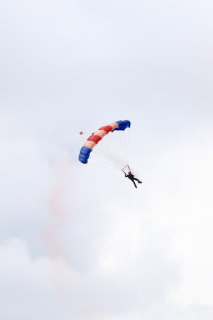A parachutist from the RAF Falcons Parachute Display Team performs in the skies above Silverstone, England.のeditorial素材