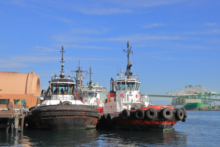Tugboats Moored in Los Angeles.  A view of tugboats moored in the port of Los Angeles.  Los Angeles is the busiest container port in North America.のeditorial素材