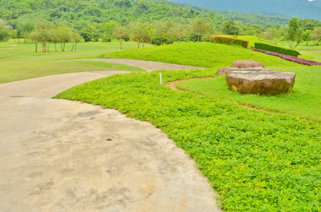 Concrete pathway on the green hillの写真素材
