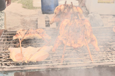 Roasting chicken on the stoveの写真素材