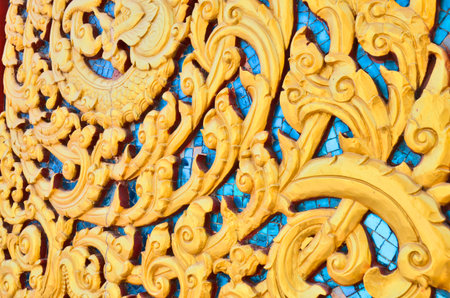 Gold thai pattern on blue mirrorの写真素材