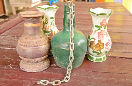 Old green bottle and old vestの写真素材