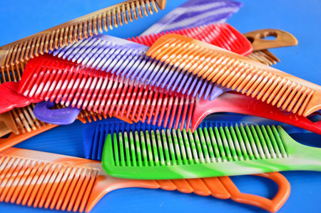 Color combs on blue backgroundの写真素材