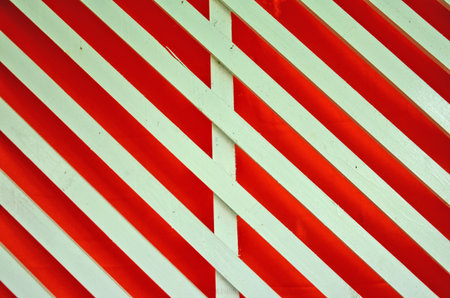 White slat on red backgroundの写真素材