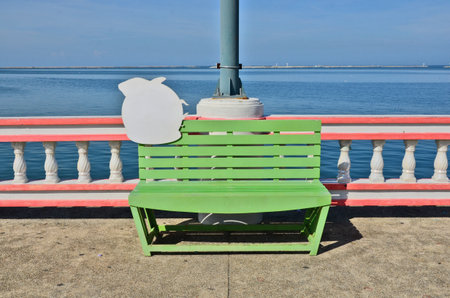 Green seat & pink fence & sea