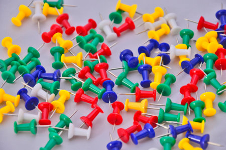 Color pegs on white floor