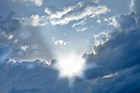 Ray of light with rainy clouds