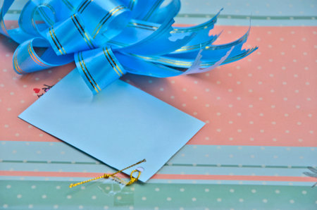 Blank card and ribbon bow on present box