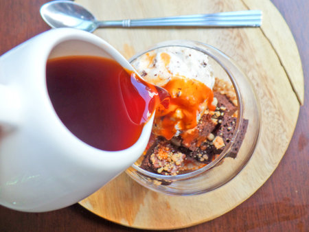 Dropping thai tea on affogatoの写真素材