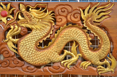 Beautiful golden craven sculpture of dragonの写真素材