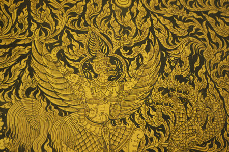 A mythology garuda with naga on black backgroundの写真素材