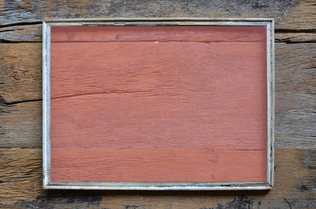 Clear pink mirror on old wood frameの写真素材