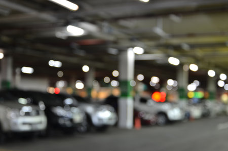 Parked cars in downstairs of departmen store, blurの写真素材