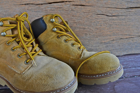 Suede shoes on wood backgroundの写真素材