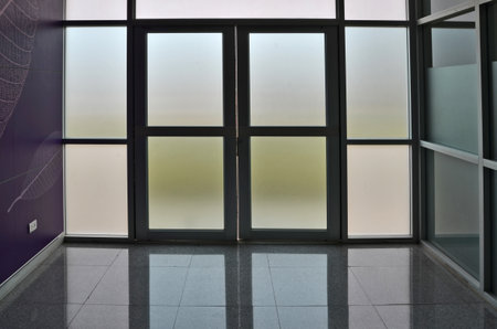 Frosted glass door and wall of buildingの写真素材