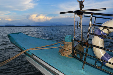 Blue boat with the sea in evening view