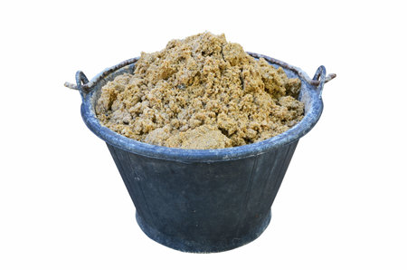 Black rubber bucket of fine sand for concrete constructionの写真素材
