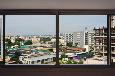 City location in the window viewer of buildingの写真素材