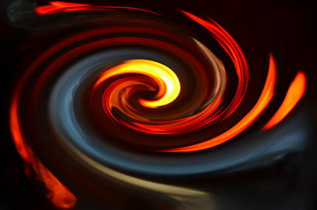 Spiral colored fire on black backgroundの写真素材
