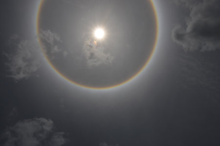 Ray fo sunlight and sun halo with thin clouds