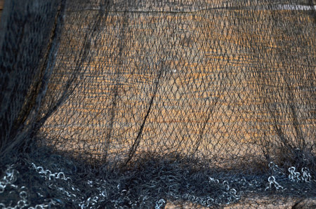 Black threads of mesh with iron chainsの写真素材