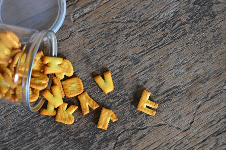 Alphabet shape of biscuits from fail glass bottleの写真素材
