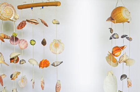 Hung shell mobile on white backgroundの写真素材