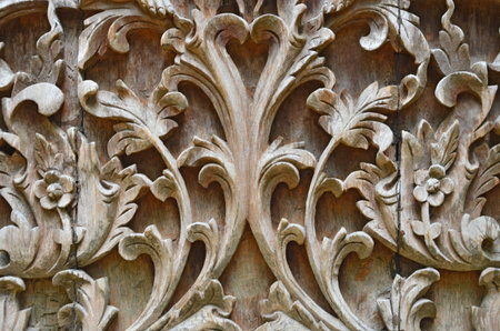 Beautiful graven wood Thai style on the wallの写真素材