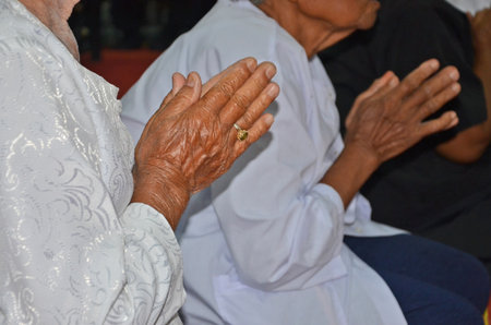 Old women pay respect to the monks