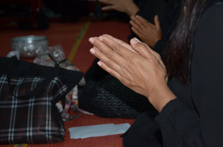Buddhist women pay respect to the monksの写真素材