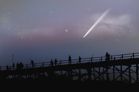 Tourists on the bridge with white comet in early morning sky
