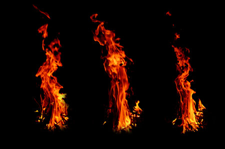 Three hot flame of fires in black backgroundの写真素材