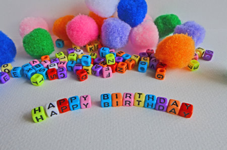 Happy birthday bead sign on white paper floorの写真素材