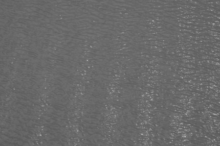 Black and white pattern of light on the waves