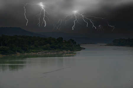 Dangerous lightning with black monsoon clouds over the earthの写真素材