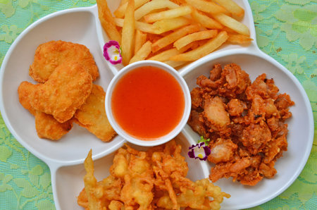 Top view of appetizer tray with chili sauce cupの写真素材